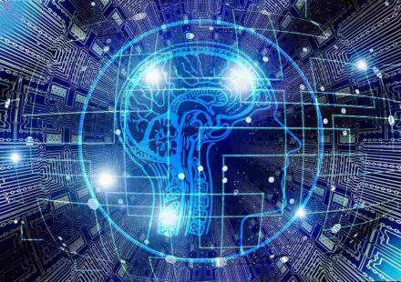 Digital human head profile overlaid with a glowing blue brain and circuit board patterns, representing artificial intelligence and machine learning