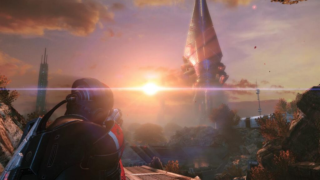 Commander Shepard looking out at a massive alien Reaper structure against a sunset
